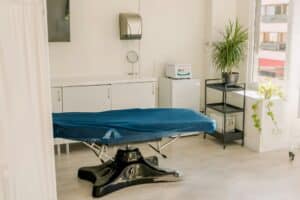 Modern medical examination couch in doctor's office